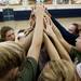 The Rudolf Steiner volleyball team puts their hands together for a cheer on Monday. Daniel Brenner I AnnArbor.com